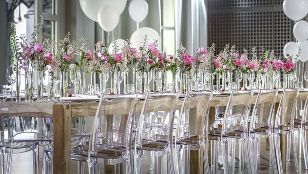 A beautiful festive table decorated with pink flowers