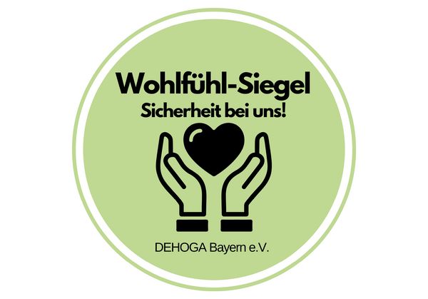 Grünes Wohlfühl Siegel der Dehoga Bayern mit schwarzer Schrift
