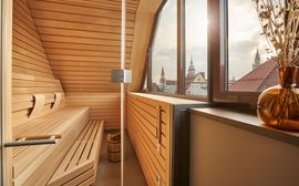 Wooden spa area "Schwitzstube" in the Platzl Hotel with a view of Munich's old town.